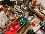 A craft room overflowing with too many crafting supplies