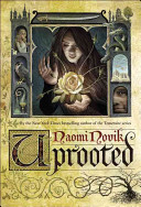 A golden cover features a hooded figure of a woman within a window. On either side of the image are two castle towers featuring images of princesses, dragons, weapons, and more. The title "Uprooted" is scrawled across the bottom in a fancy font. 