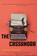 A coral colored background features a black/brown typewriter in the center. Starting by the keyboard and wrapping towards the bottom of the typewriter is the title in a black font.