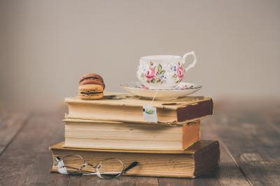 image of tea cup on top of books