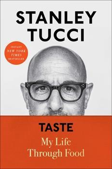 Half of Stanley Tucci's face peers out over an orange band across the bottom cover of the book. In this orange band of color is the title "Taste My Life Through Food"