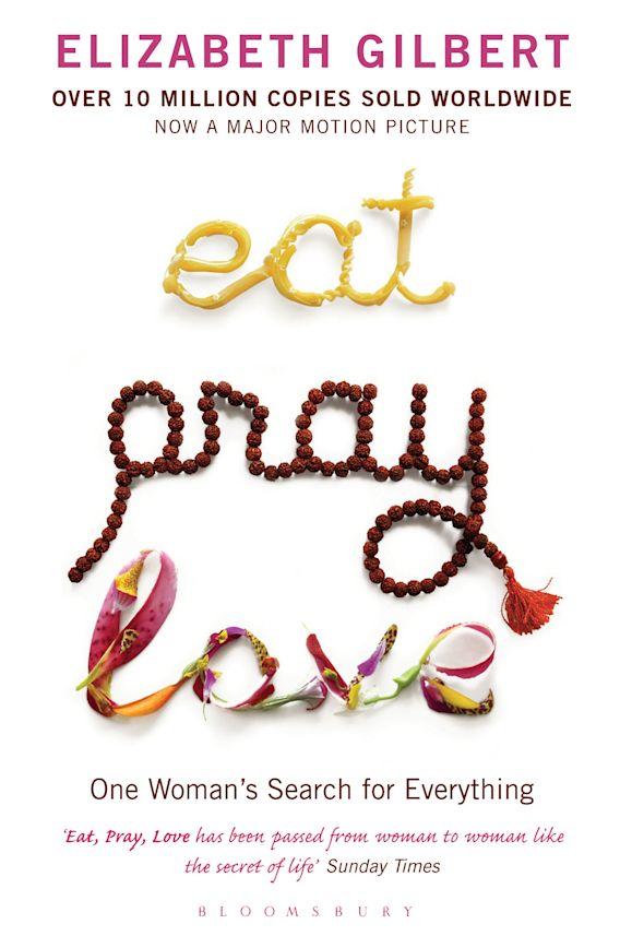 The word eat is spelled out in pasta noodles, the work pray is spelled out in prayer beads, and love is spelled out in pieces of flower.